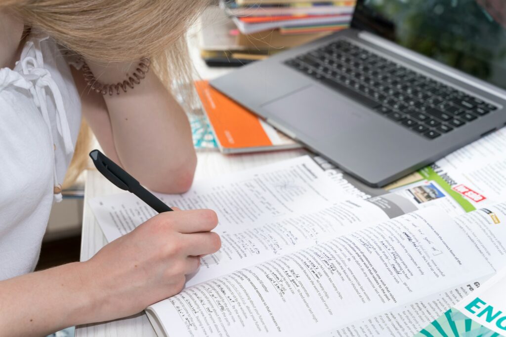 girl doing homework in english